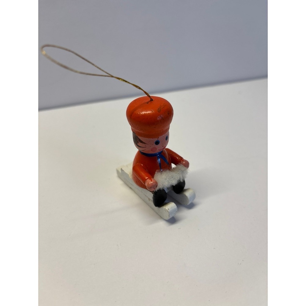 Vintage wooden boy in Orange sledding ornaments